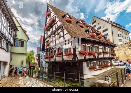 Ulm, Germany – July 20, 2019: Hotel Schiefes Haus or Crooked House in old Fisherman`s Quarter. It is famous tourist attraction of Ulm. Vintage half-ti Stock Photo